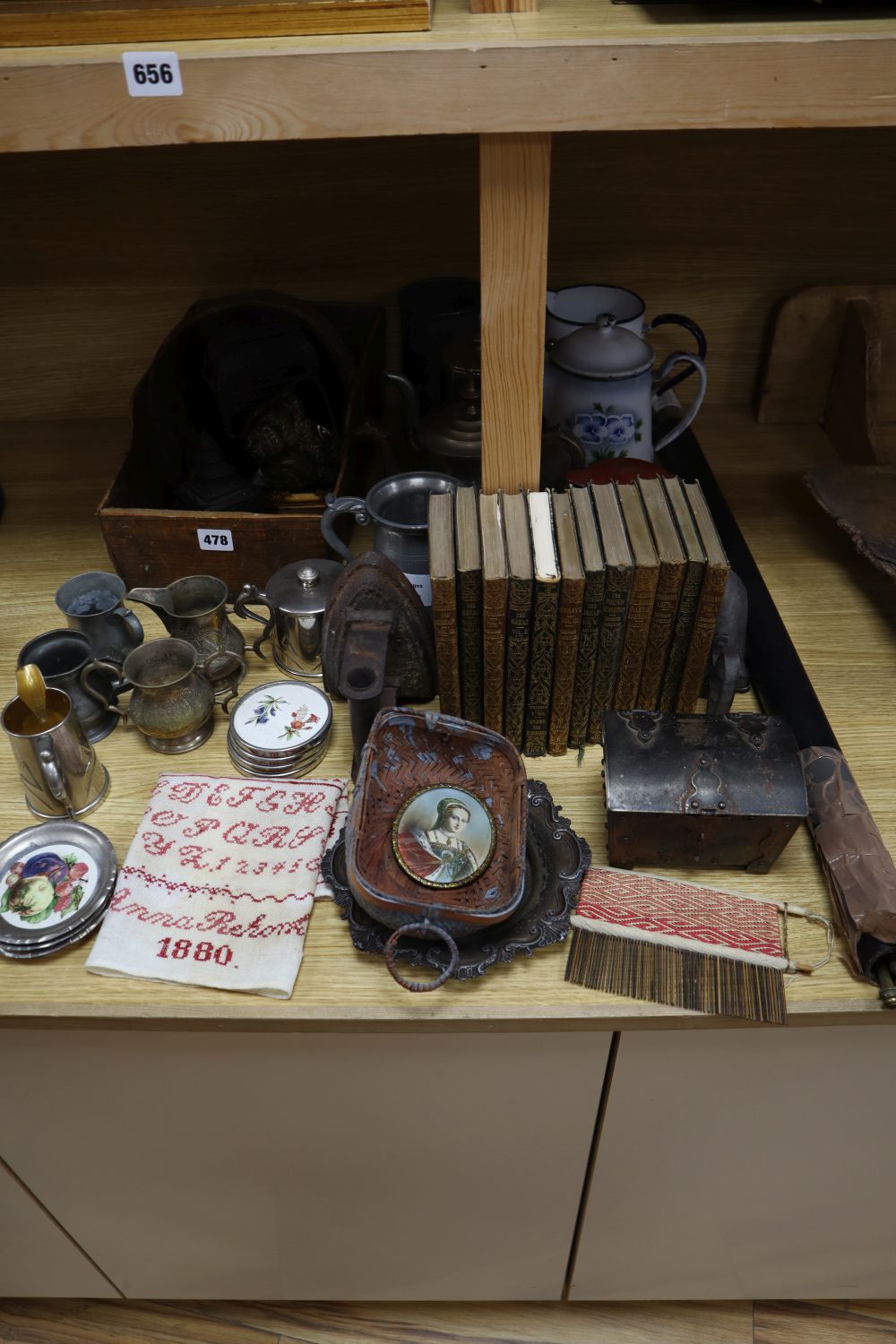 Assorted decorative objects including metalware, books, etc.